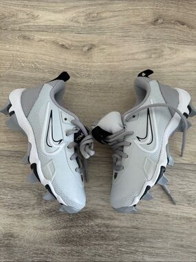 Nike Light Gray and White Cleats with Black Swoosh